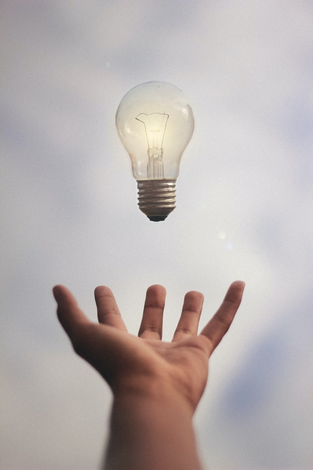 person catching light bulb / Photo by Júnior Ferreira on Unsplash
